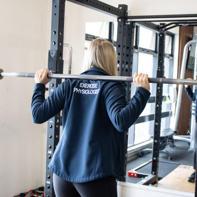 My Local Physio Plus My Local Exercise Physiology Exercise Physiologist lifting weight at benefitness gym